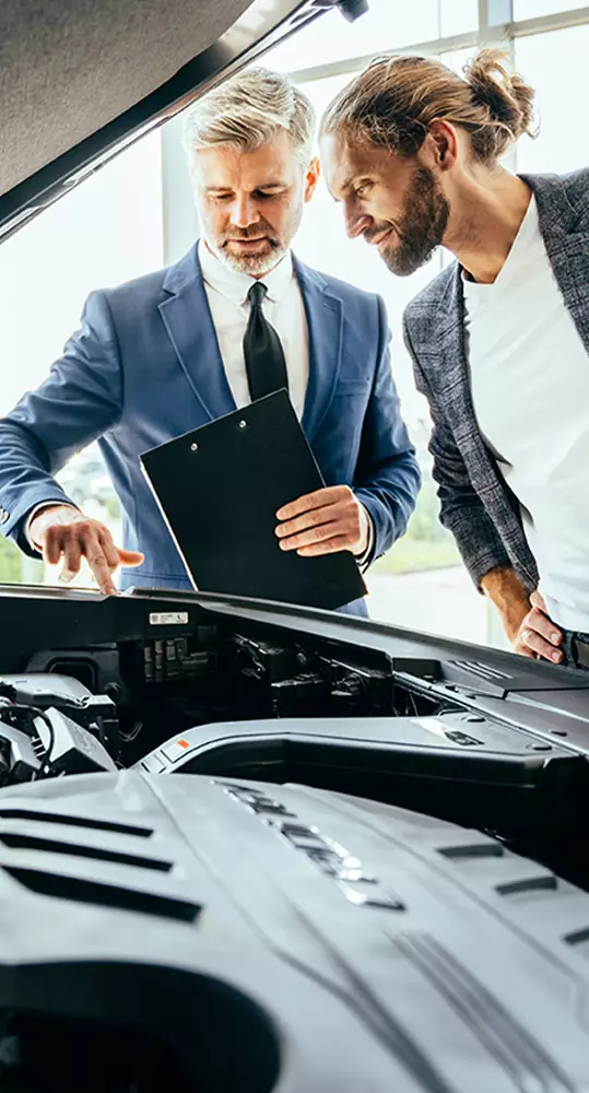 Technician servicing a vehicle