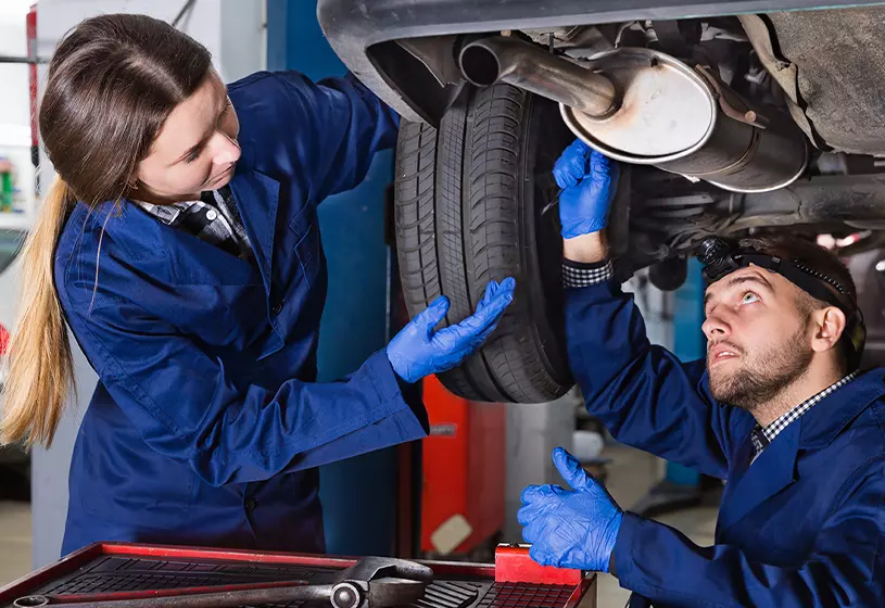 techs working under car