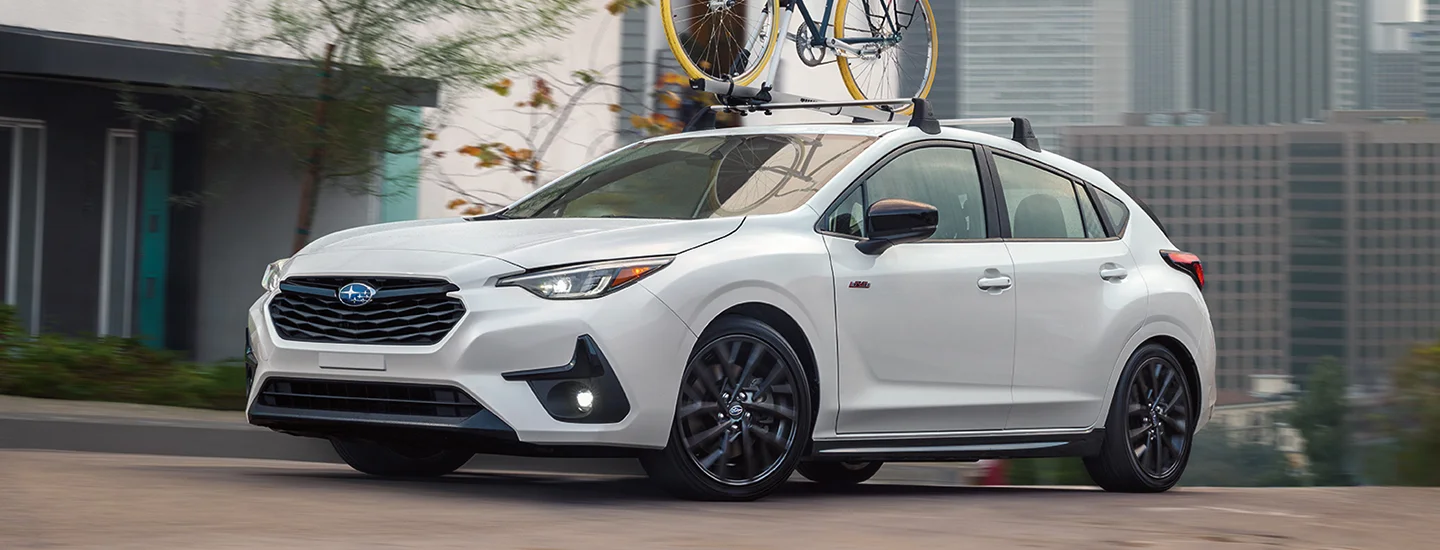white Subaru Impreza parked