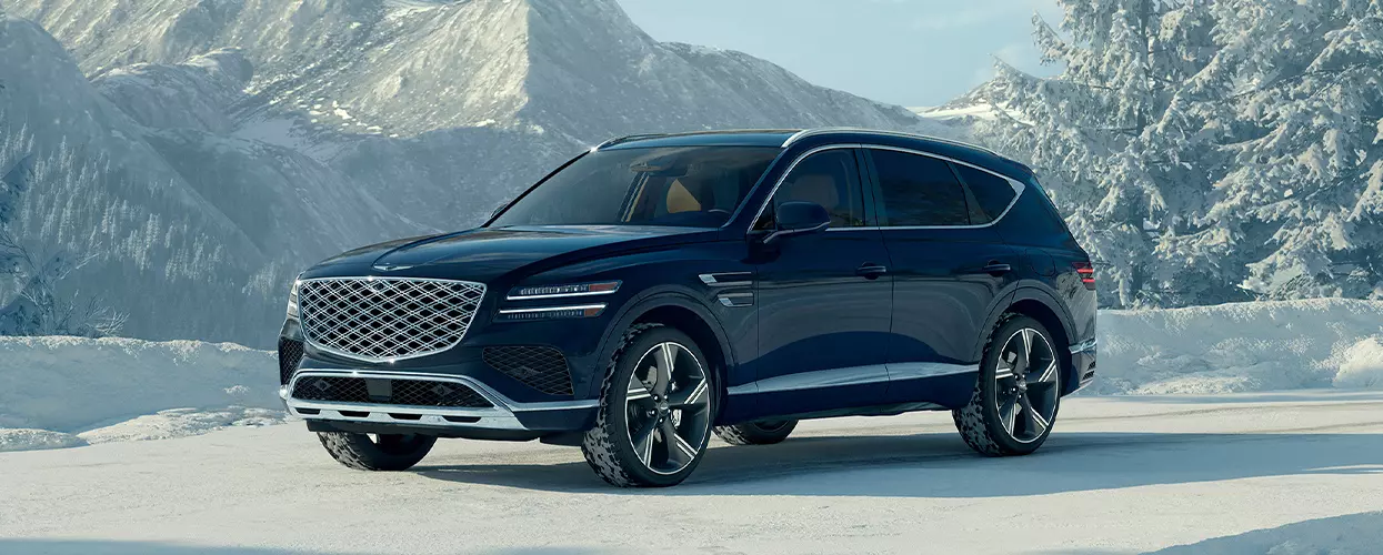 2026 Genesis GV80 parked in snowy mountains