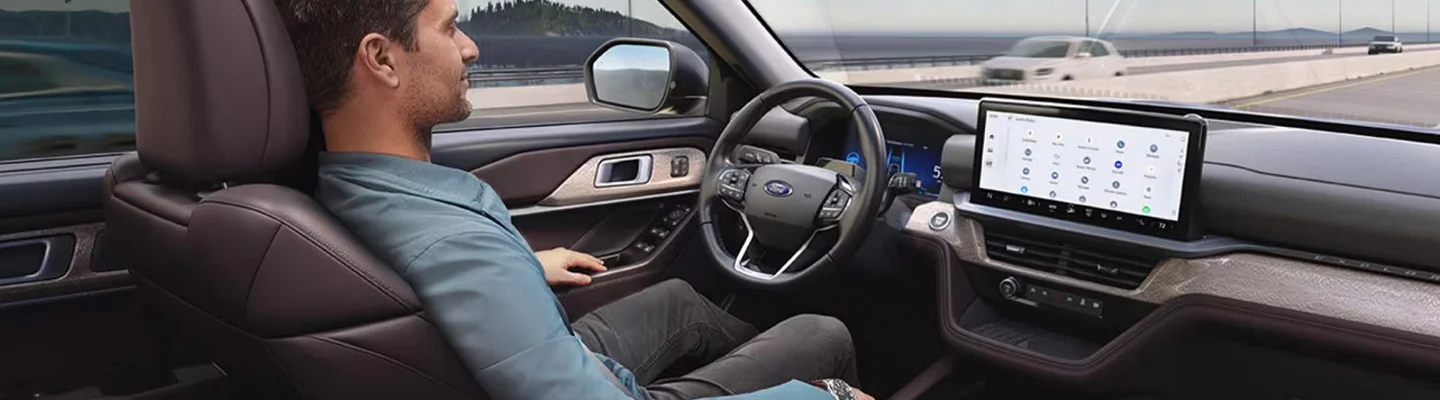 driver in car driving with blue cruise on