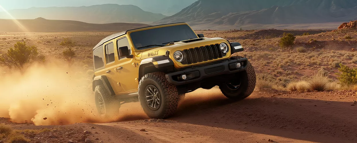 2026 Jeep Wrangler driving on a desert road