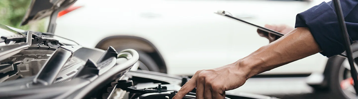 Service technician checking a Subaru vehicle in Nederland, TX