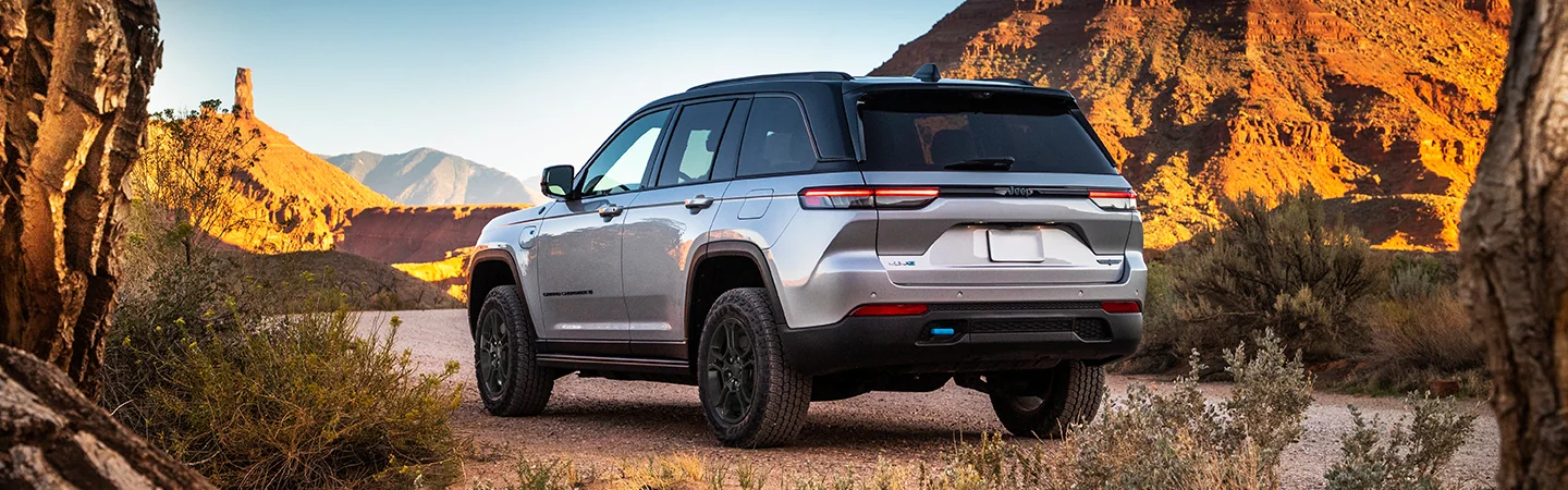 2025 Jeep Grand Cherokee dark gray color parked in hill road