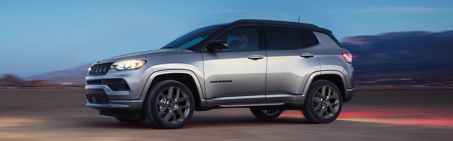 2025 Jeep Grand Cherokee dark gray color running on road