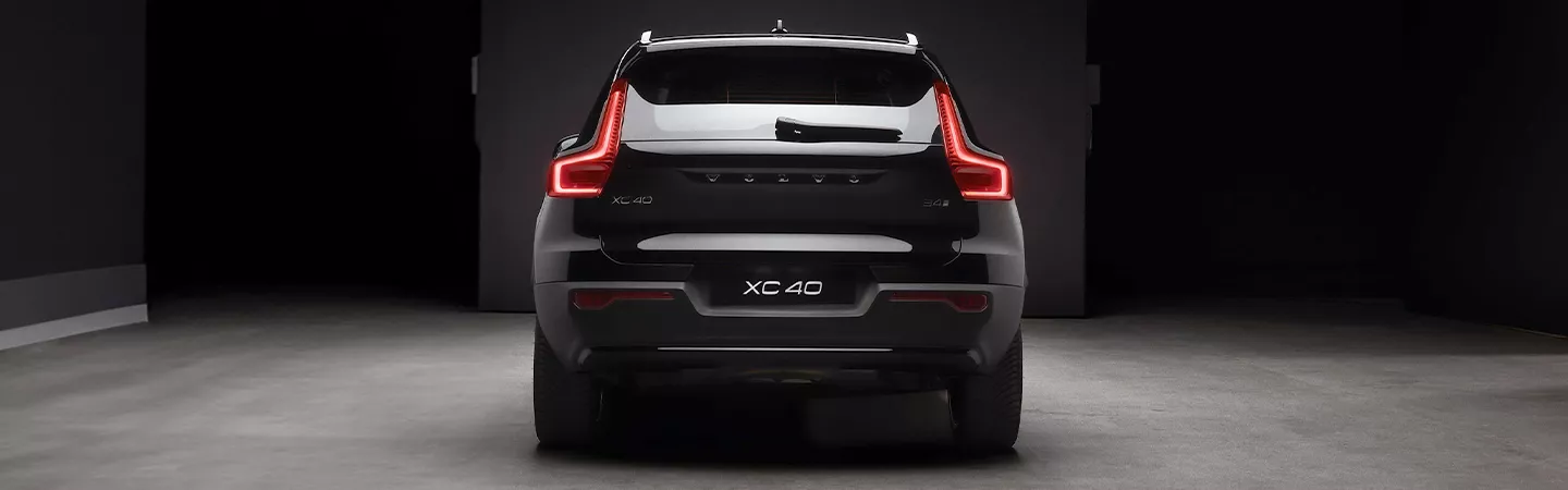 Back view of a 2026 Volvo XC40 parked in a dark parking lot
