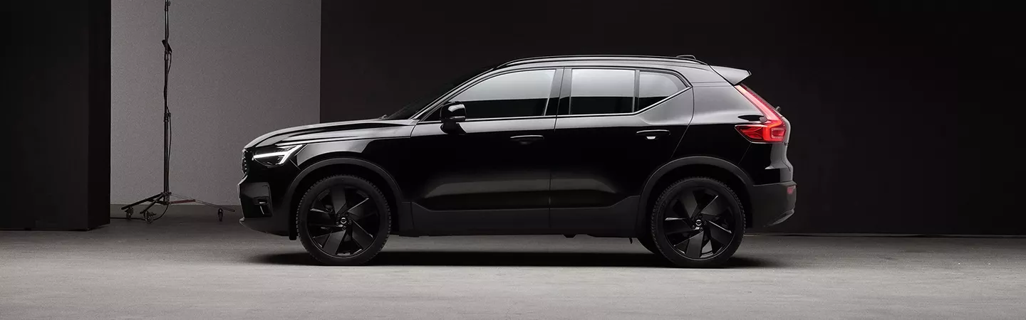 Side view of a 2026 Volvo XC40 parked in a dark parking lot