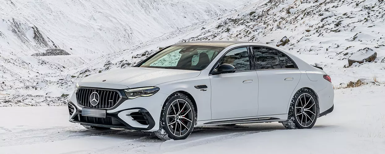 Mercedes-Benz vehicles parked on a snowy road