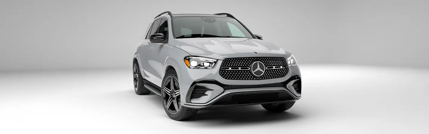 Front view of a parked 2025 Mercedes-Benz GLE Coupe in a gray room