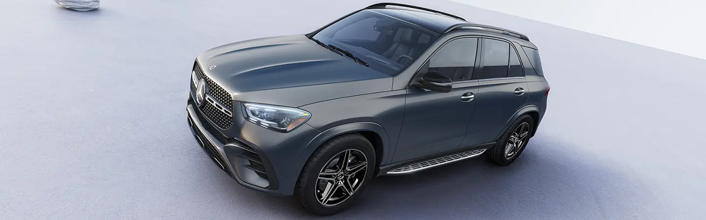 Side view of a park dark gray 2025 Mercedes-Benz GLE Coupe