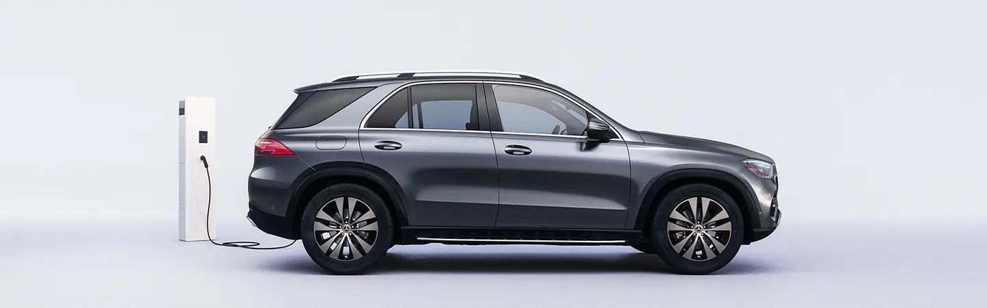 Side view of a gray 2025 Mercedes-Benz GLE Coupe charging