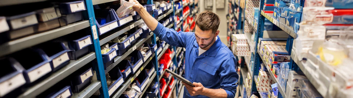 Service person looking for parts in parts department