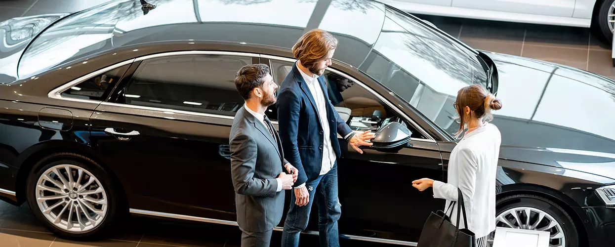 Side view of a parked blue 2026 Volvo in showroom