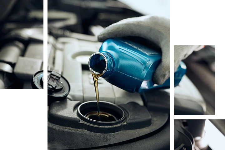 BMW service tech preforming an oil change
