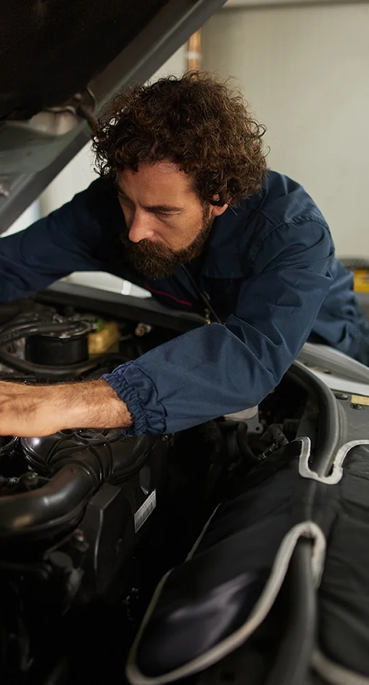 A service tech working on a engine