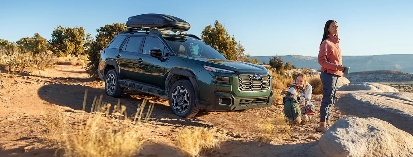Front side view of a 2026 Subaru Outback Wilderness parked on a cliff side