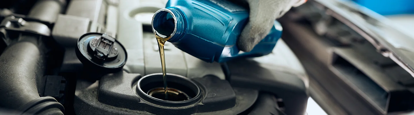 Oil change pouring into engine service Carthage, MO