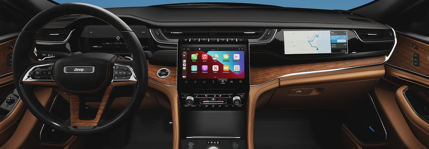 Interior view of the dashboard and tech of a 2025 Jeep Grand Cherokee