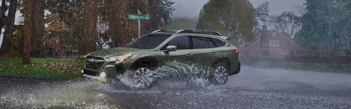 2025 Subaru Outback driving in the rain