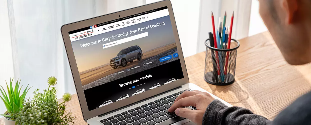 Shopper browsing car inventory online on a laptop