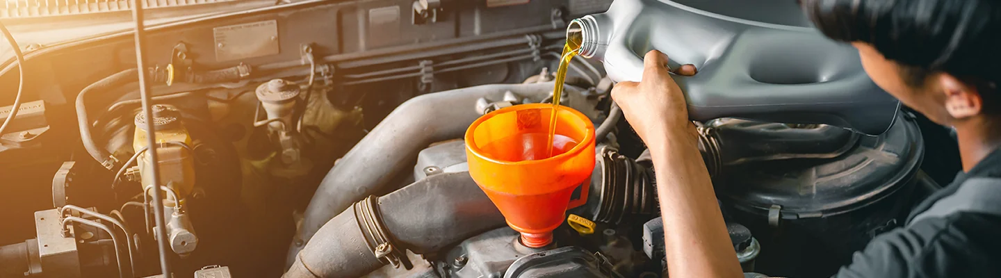 Service technicians changes oil at Villages Subaru in Leesburg, FL