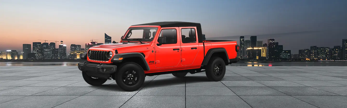 Side view of a parked red 2025 Jeep Gladiator with a city in the background