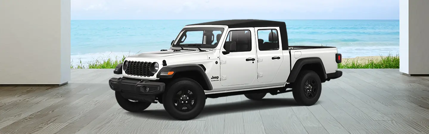 Side view of a parked white 2025 Jeep Gladiator with a beach in the abckground