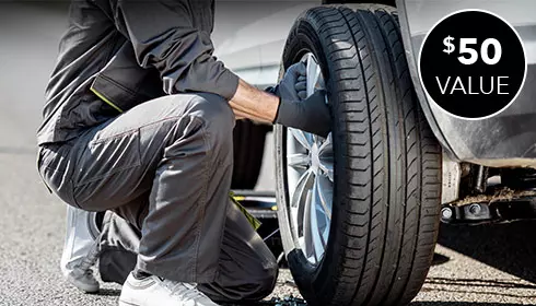 guy filling up flat tire $50 value burst