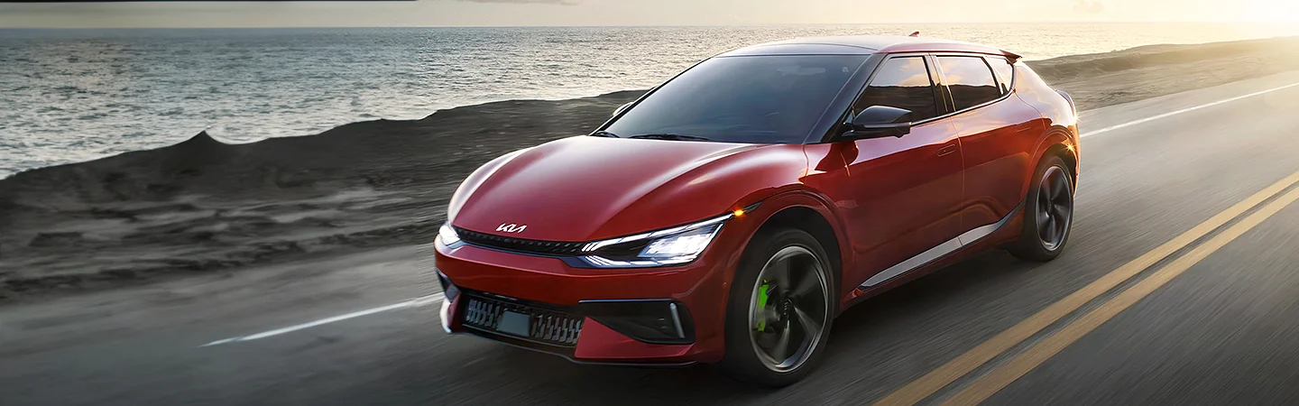 2024 Kia EV6 vs Ford Mustang Mach-E red color and front view
