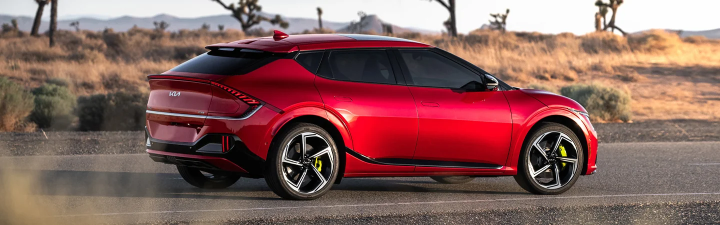2024 Kia EV6 vs Ford Mustang Mach-E red color and side view