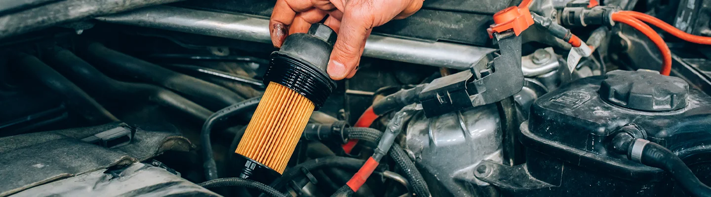 Service technician changes a filter on a Ram 1500 at CDJR Tampa Bay