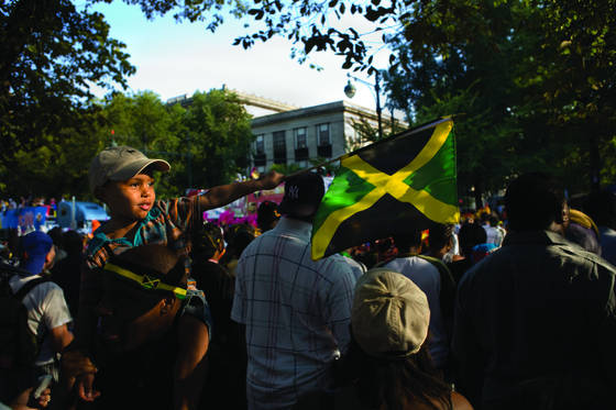 Young_boy_pointing_jamaican_flag