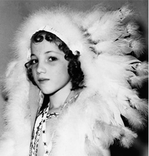 Yvonne Chouteau, 7, is shown with headdress.