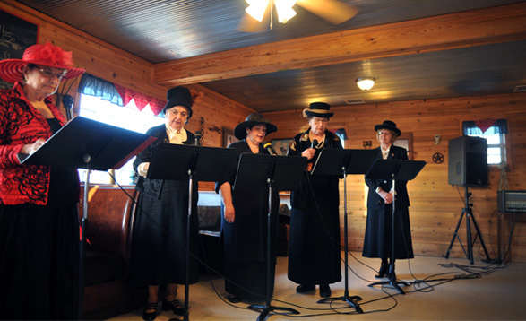 The 'Beer City Gals' re-enact the history of one of Oklahoma's rowdy pre-statehood towns. Performing in costume are, from left, Pauline Hodges (as 'Pussy Cat' Nell Jones), Earlene Schaefer, Pamela French, Virginia Frantz and Vicki Shelburne. 