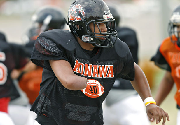 Stephen Cully runs drills with his teammates during practice at Konawa High School in Konawa, Okla., on Monday, Aug. 29, 2011.