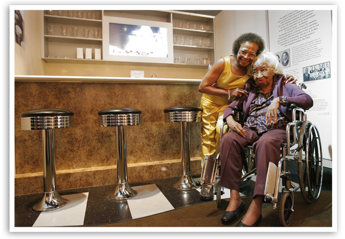 Clara Luper, seated, poses for a photo with her daughter Marilyn, in the Oklahoma History Center's display of the Katz Drug Store where the sit-in occurred 50 years ago, Tuesday, August, 19, 2008.