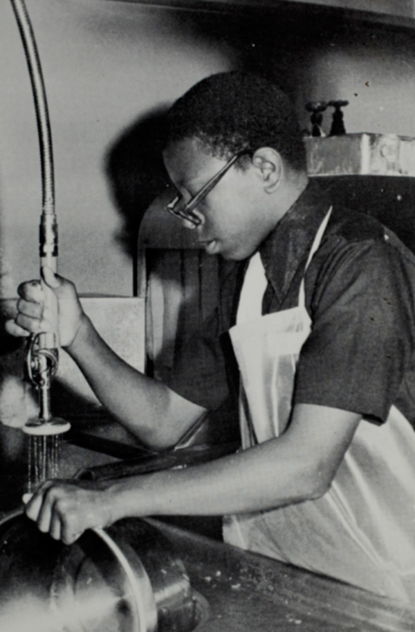 A young Currie Ballard washes dishes at Vanalog Junior High School in Compton, CA. in 1972. Ballard worked hard at school and extracurricular activities to keep out of trouble in the violence-prone south central LA neighborhoods.