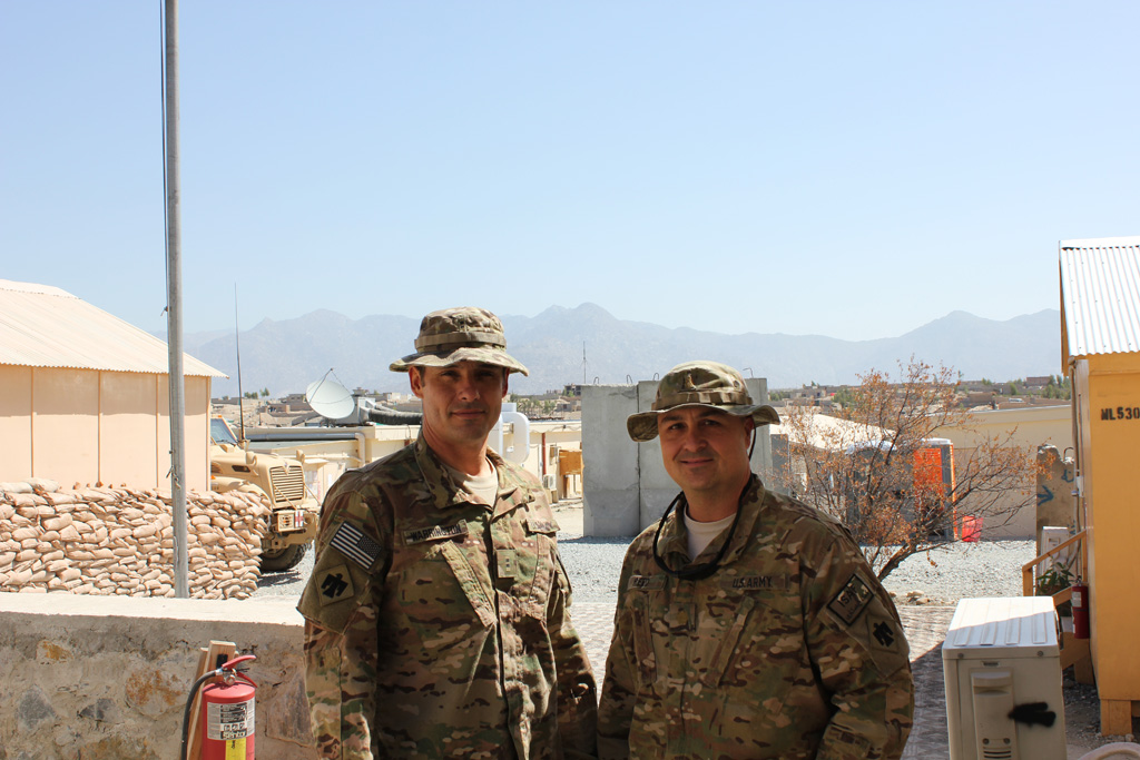Warrant Officer 2 Todd Warrington, left, and Maj. Casey Reed are part of the Oklahoma Army National Guard's 45th Infantry Brigade Combat Team in Afghanistan. Warrington's son Dakota is a Mustang junior receiver/defensive back, and Reed's son Berkeley is Edmond North's junior deep snapper. Warrant Officer 2 Todd Warrington, left, and Maj. Casey Reed are part of the Oklahoma Army National Guard's 45th Infantry Brigade Combat Team in Afghanistan. Warrington's son Dakota is a Mustang junior receiver/defensive back, and Reed's son Berkeley is Edmond North's junior deep snapper.
