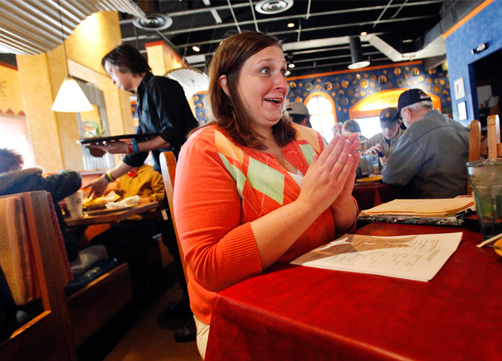 Michelle Kelley reacts after signing the paperwork that certified her to become an adoptive parent on Monday, Feb. 23, 2009.