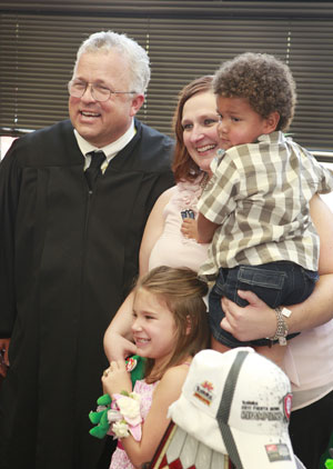 Judge Kirby poses for a photo with Michelle Kelley and her adopted children Darlin' and Biggin' after their Adoption Ceremony, Thursday, July 28, 2011. The children were in foster care for several years and are now being adopted by the single mother at the Oklahoma County Juvenile Justice Center, 5905 Classen Boulevard, in Judge Kirby's chambers.