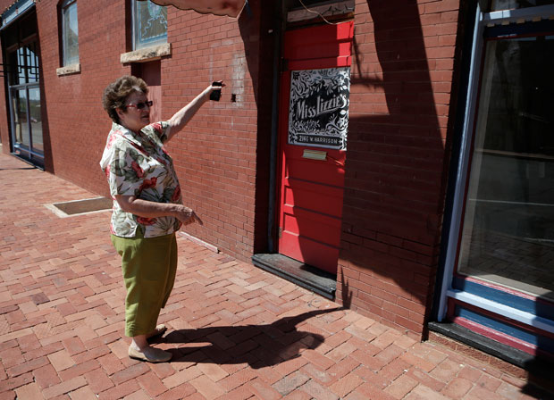 Maxine Pruitt, Guthrie's municipal service director, stands outside the door to Miss Lizzie's.