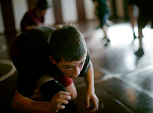 Sixth-grader Cody Delaney participates in a morning practice. Delaney said he hopes his own kids grow up to be Perry wrestlers one day. 