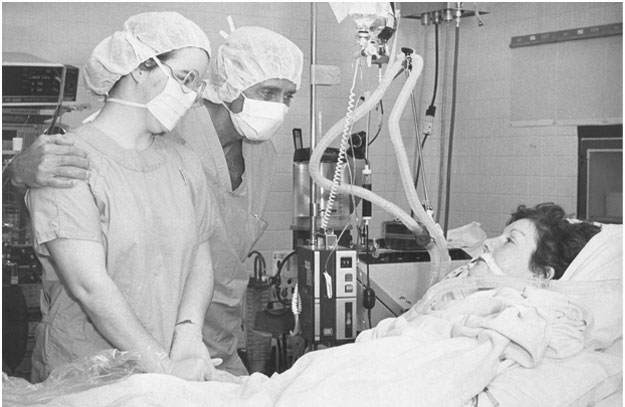 Nancy Segars Rogers, the 45-year-old woman who is Oklahoma's first heart transplant patient, is visited at Baptist Medical Center by her daughter, Nancian, and surgeon Dr. Nazih Zuhdi.