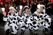 Protesters wearing cow costumes symbolizing imported U.S. beef containing mad cow disease participate in a rally against a free trade agreement with the United States in Seoul, South Korea, Monday, March 26, 2007. South Korea warned Monday a potential free trade agreement with the United States coul