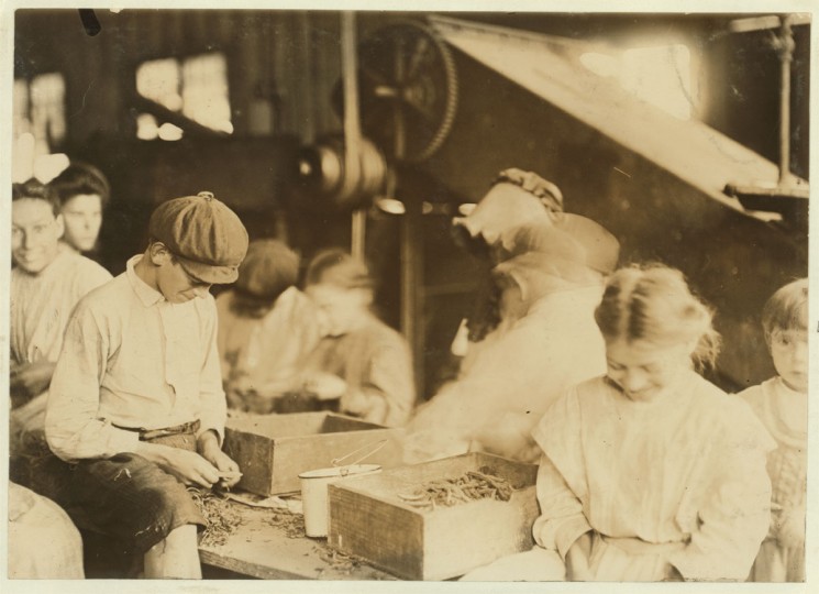 Group of workers stringing beans in J. S. Farrand Packing Company, Baltimore, Md. Many youngsters work here. Photo July 7, 1909. Location: Baltimore, Maryland. (Lewis Hine/Photo courtesy LOC)