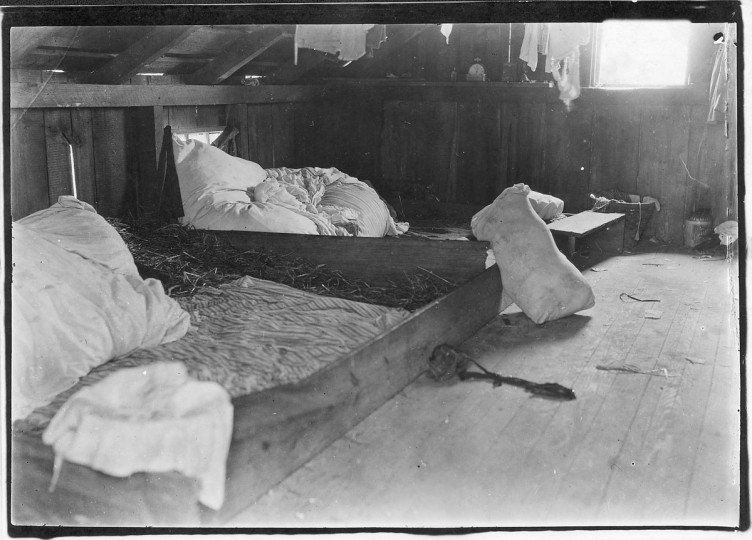 Original Caption: Interior of one family room on upper floor of one of the berry picker shacks, Bottomley's farm. Rock Creek, Md, June 1909. (Lewis Hine/Photo courtesy of NARA)