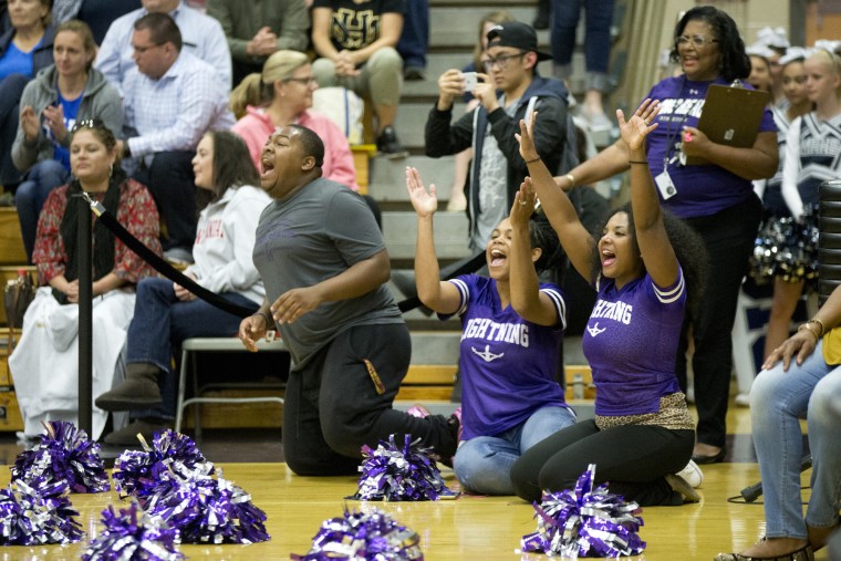 Long Reach coaches including Nikkia Johnson, bottom right, cheer on