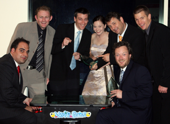 After winning two categories in the WA Web Awards five Senses Web Developer, Jordan Brock [seated right] challenged Events Co-ordinator for the Australian Web Industry Association, Myles Eftos [seated left] to classic game of 1942 with the Five Senses crew in support. Then everyone lost interest and got excited for the photo. From left at the back: Brad Butler, Ash Brian, Bree Paterson, Dean Gallagher and Jay Holland.