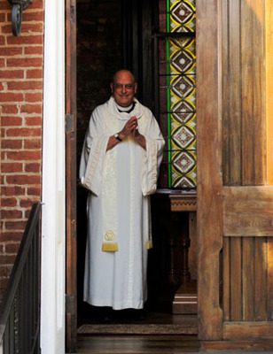 Butcher Trinity Russellville Photo of Geoffrey Butcher in alb in Trinity doorway