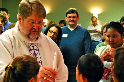 Bishop giving candle Bishop giving candle